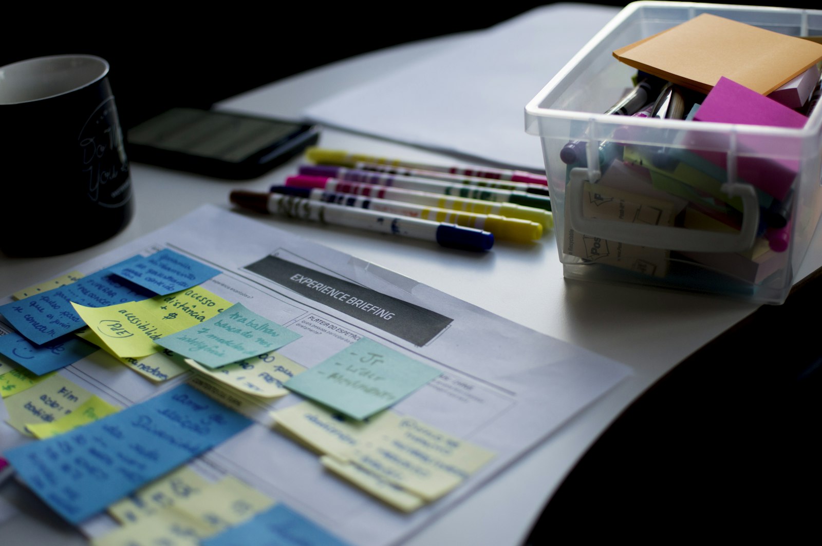 A briefing sheet marked up with notes where the data model took shape