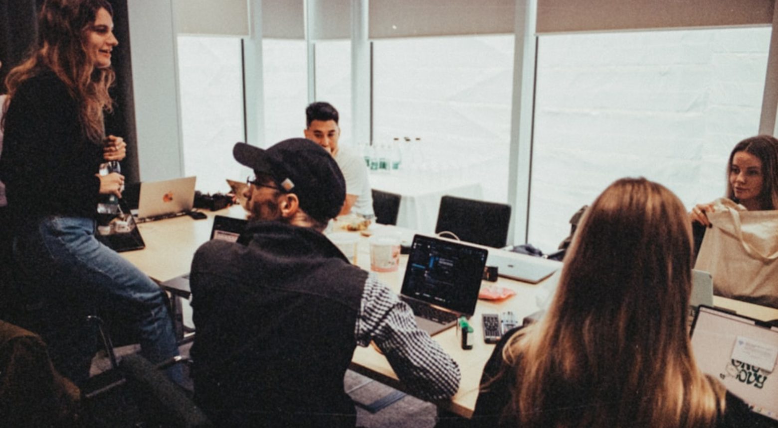 The team talking through work in the meeting room