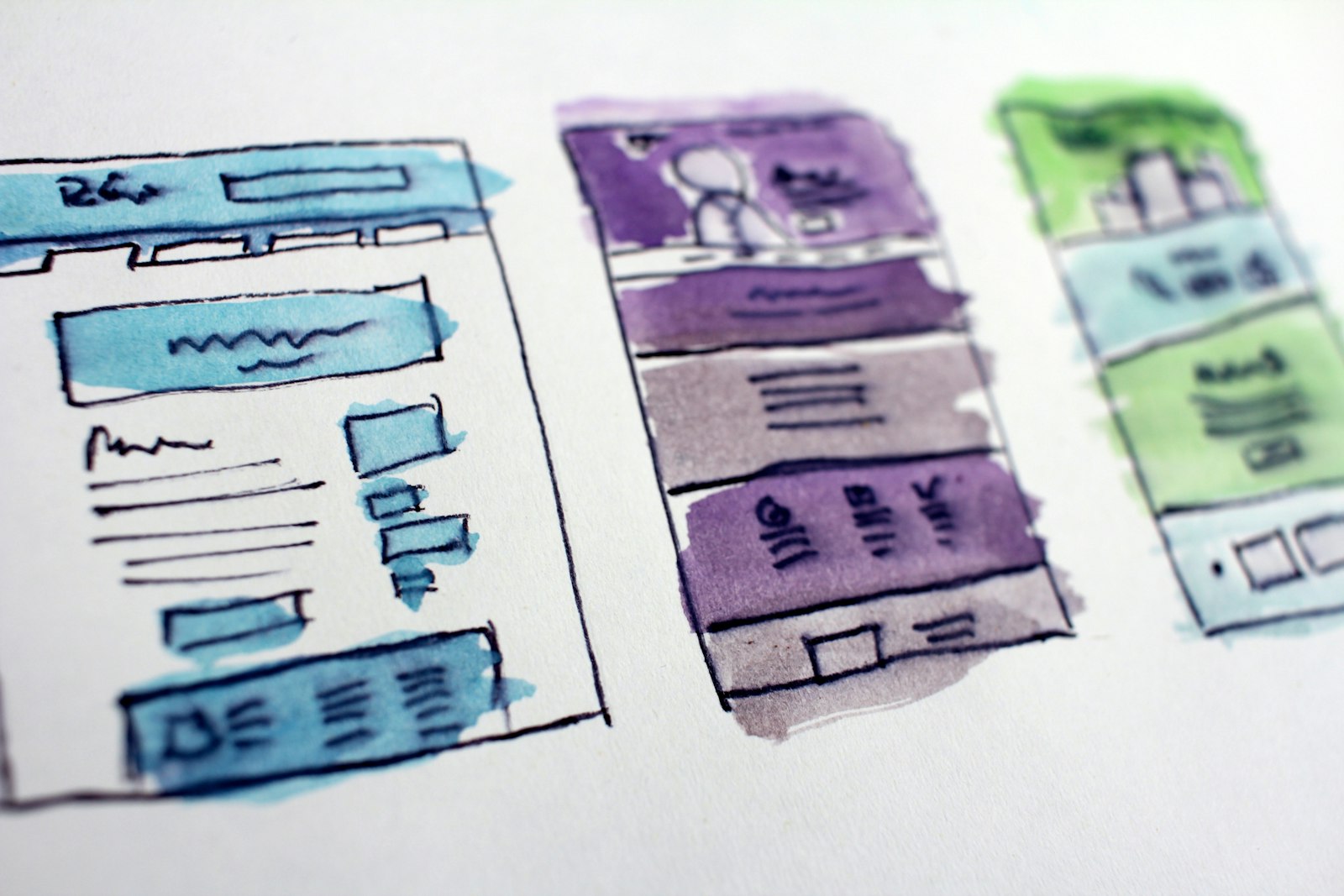 Painted wireframes of the screens before anything is built